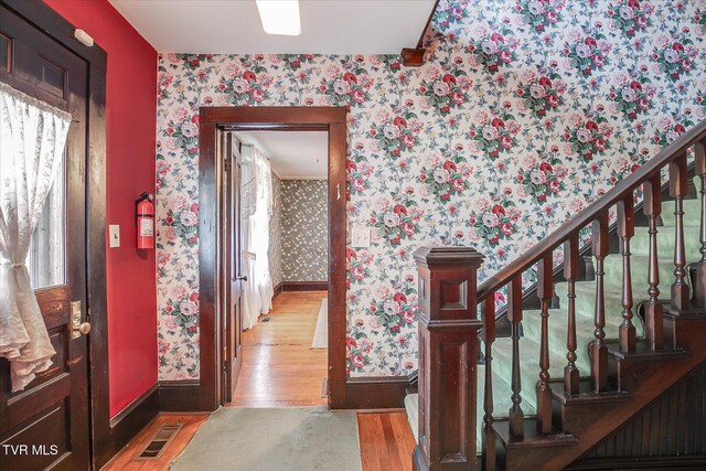 454 Cedar St, Bluff City, TN 37618 - entryway with wallpapered walls, wood finished floors, and stairs