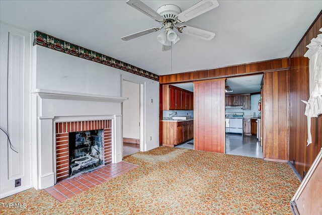 454 Cedar St, Bluff City, TN 37618 - unfurnished living room with a ceiling fan and a brick fireplace