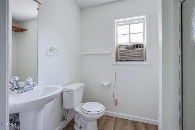 454 Cedar St, Bluff City, TN 37618 - bathroom with wood finished floors and cooling unit