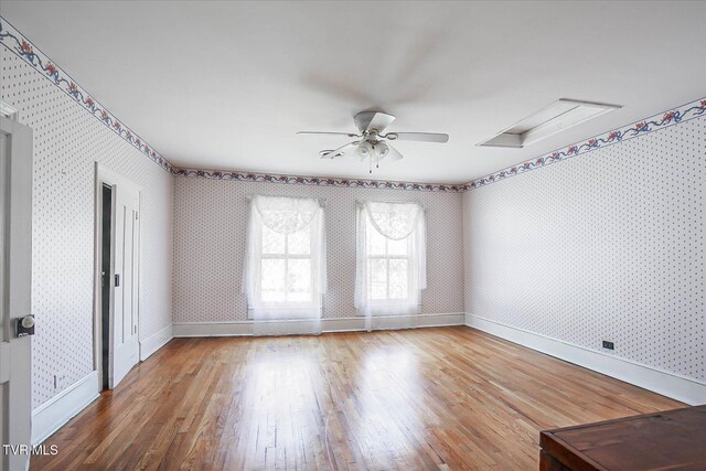 454 Cedar St, Bluff City, TN 37618 - empty room featuring wallpapered walls, ceiling fan, and wood finished floors
