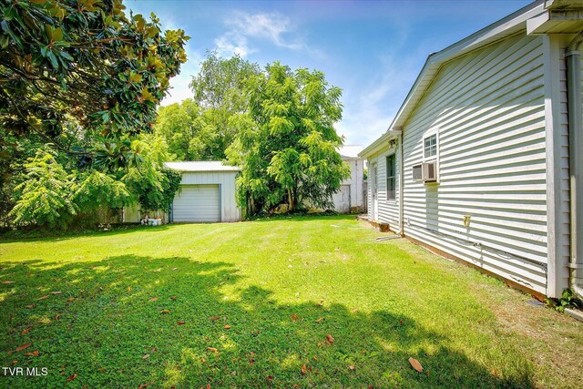 454 Cedar St, Bluff City, TN 37618 - view of grassy yard featuring an outbuilding and cooling unit