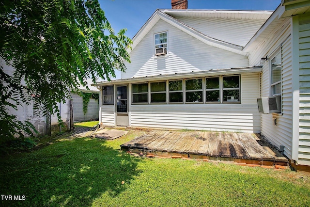 454 Cedar St, Bluff City, TN 37618 - back of house with a chimney, cooling unit, a wooden deck, a lawn, and a sunroom