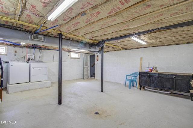 below grade area with washing machine and clothes dryer