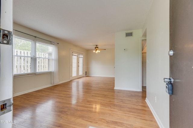 515 Pilgrim Ct Unit B, Johnson City, TN 37601 - empty room with a ceiling fan, light wood finished floors, and baseboards