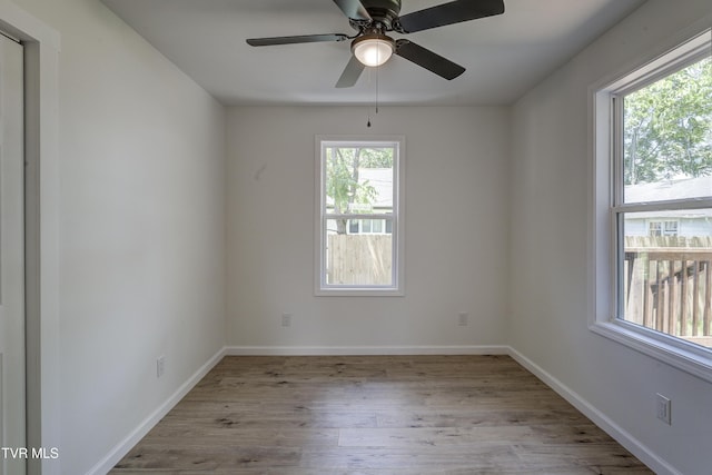 2116 Steadman St, Kingsport, TN 37664 - empty room with wood finished floors, baseboards, and a ceiling fan
