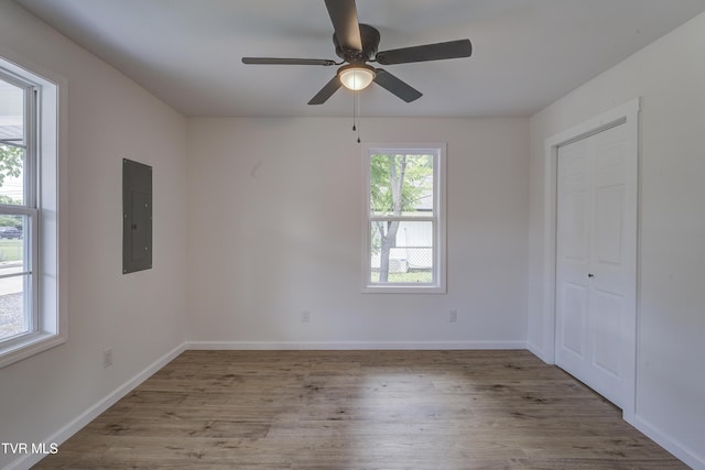 2116 Steadman St, Kingsport, TN 37664 - unfurnished room featuring electric panel, wood finished floors, a ceiling fan, and baseboards