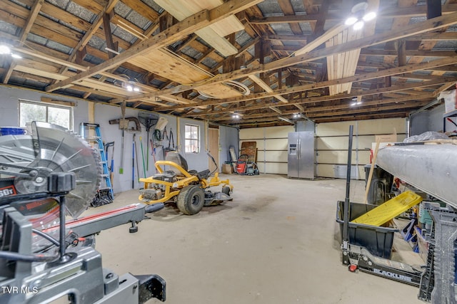 373 Mckeehan Ridge Rd, Elizabethton, TN 37643 - garage featuring stainless steel refrigerator with ice dispenser