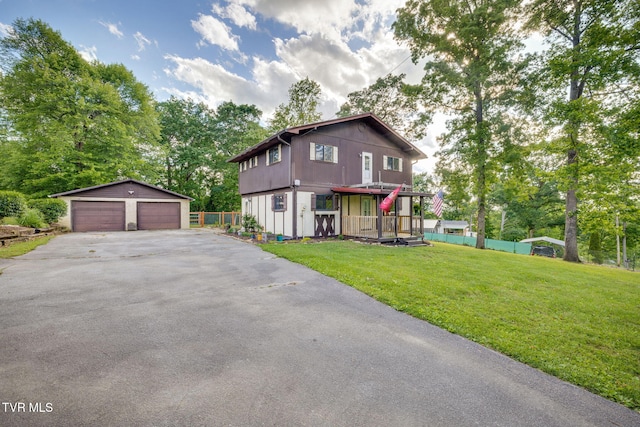 373 Mckeehan Ridge Rd, Elizabethton, TN 37643 - view of front of home with a detached garage, an outbuilding, and view of wooded area