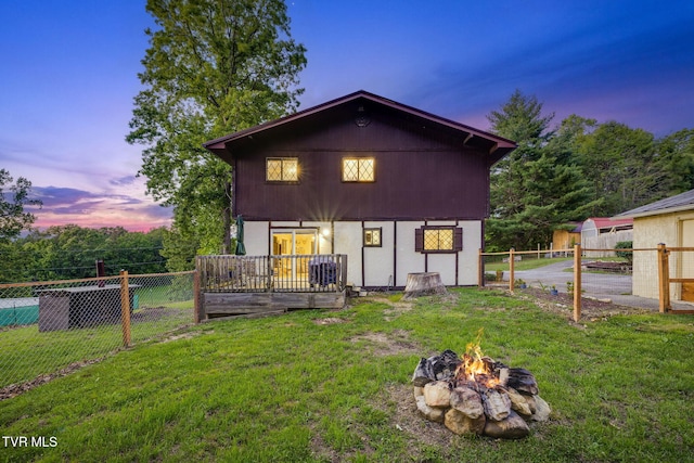 373 Mckeehan Ridge Rd, Elizabethton, TN 37643 - back of house at dusk with a fire pit and a deck