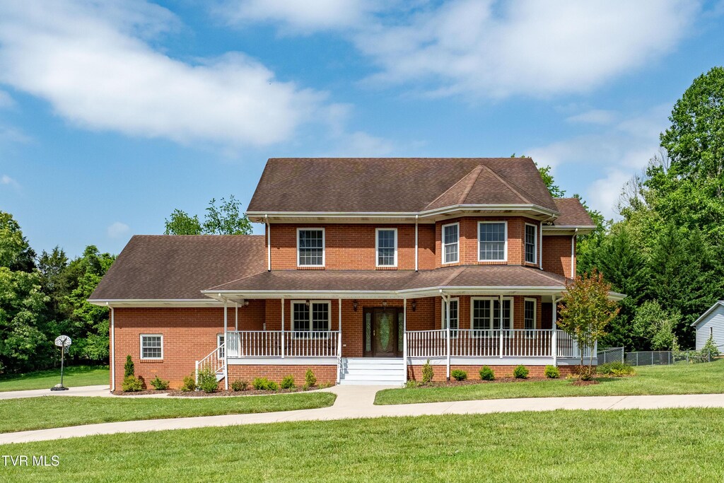 4601 Stillwood Ct, Kingsport, TN 37664 - victorian home featuring covered porch, a front lawn, and brick siding