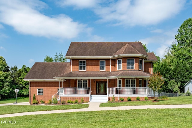 4601 Stillwood Ct, Kingsport, TN 37664 - victorian home featuring covered porch, a front lawn, and brick siding