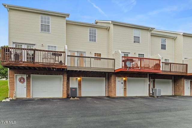 212 Amanda Ln Unit 2, Bristol, TN 37620 - rear view of property with a garage, driveway, and cooling unit