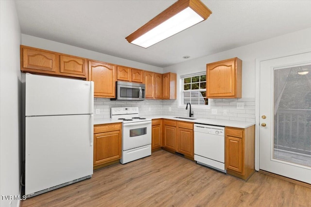 212 Amanda Ln Unit 2, Bristol, TN 37620 - kitchen with white appliances, a sink, light countertops, backsplash, and light wood-style floors