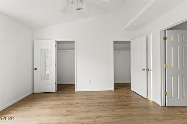 212 Amanda Ln Unit 2, Bristol, TN 37620 - unfurnished bedroom featuring light wood-type flooring, multiple closets, baseboards, and vaulted ceiling