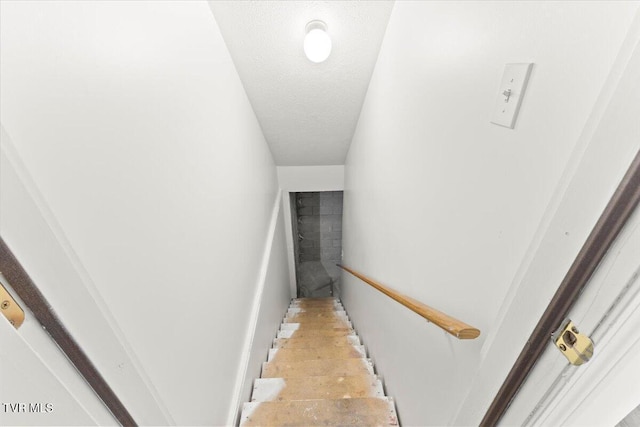 212 Amanda Ln Unit 2, Bristol, TN 37620 - staircase featuring a textured ceiling
