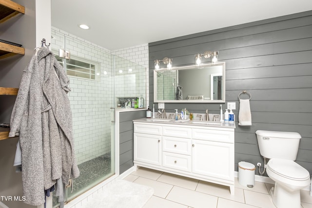 full bathroom featuring a walk in shower, tile patterned floors, toilet, double vanity, and recessed lighting