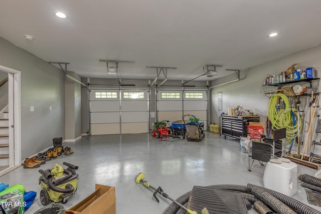 garage featuring recessed lighting and a garage door opener
