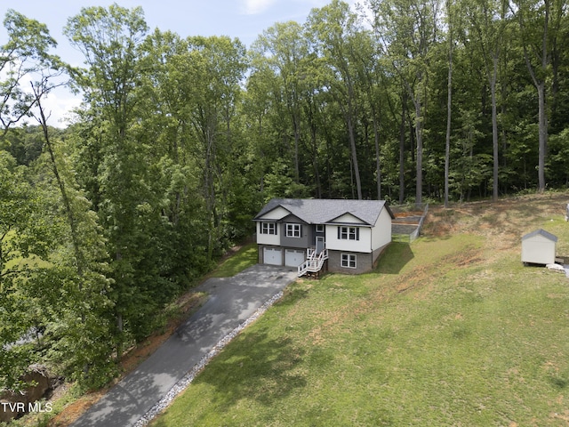 view from above of property featuring a heavily wooded area