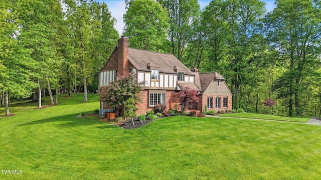 150 NW New Melrose St, Coeburn, VA 24230 - tudor-style house featuring a chimney and a front yard