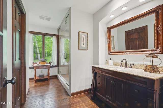 150 NW New Melrose St, Coeburn, VA 24230 - full bath with baseboards, hardwood / wood-style flooring, a stall shower, vanity, and recessed lighting