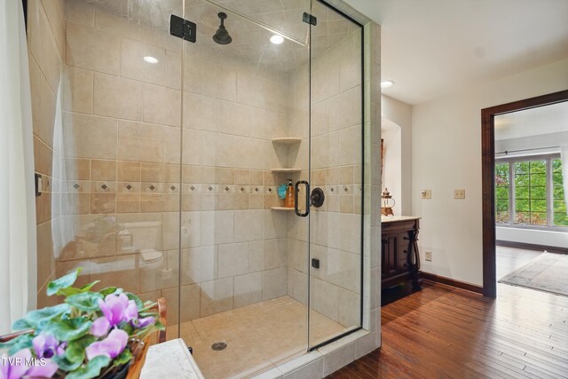 150 NW New Melrose St, Coeburn, VA 24230 - full bath with wood finished floors, a shower stall, baseboards, vanity, and recessed lighting