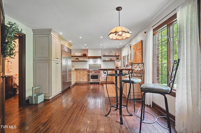 150 NW New Melrose St, Coeburn, VA 24230 - kitchen with high quality appliances, open shelves, dark wood-type flooring, custom exhaust hood, and hanging light fixtures