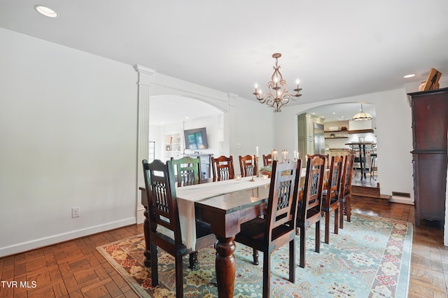 150 NW New Melrose St, Coeburn, VA 24230 - dining space with arched walkways, a chandelier, baseboards, recessed lighting, and a baseboard heating unit