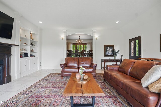 150 NW New Melrose St, Coeburn, VA 24230 - living room with built in features, arched walkways, a chandelier, baseboards, and recessed lighting