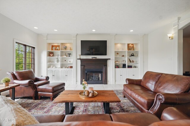 150 NW New Melrose St, Coeburn, VA 24230 - tiled living area featuring built in shelves, a fireplace with flush hearth, and recessed lighting