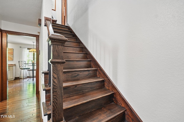 150 NW New Melrose St, Coeburn, VA 24230 - stairs with hardwood / wood-style floors and a textured wall