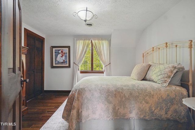 150 NW New Melrose St, Coeburn, VA 24230 - bedroom with dark wood-type flooring, a textured ceiling, and baseboards