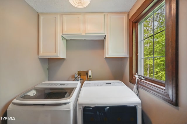 150 NW New Melrose St, Coeburn, VA 24230 - washroom featuring cabinet space, washing machine and dryer, and a textured ceiling