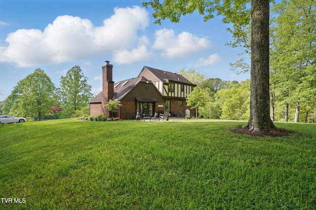 150 NW New Melrose St, Coeburn, VA 24230 - rear view of house with a yard, a chimney, a patio area, and brick siding