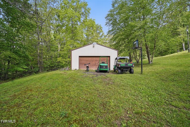 150 NW New Melrose St, Coeburn, VA 24230 - view of green lawn featuring an outbuilding and a detached garage