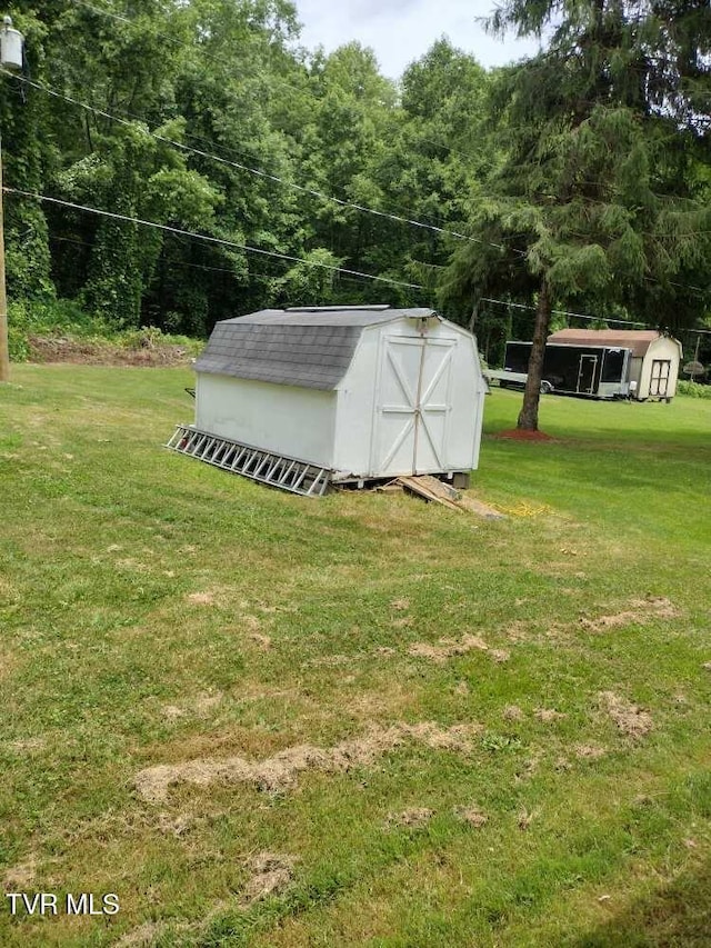 200 Glenbrook Mountain Rd, Keokee, VA 24265 - view of green lawn with a storage unit and an outbuilding