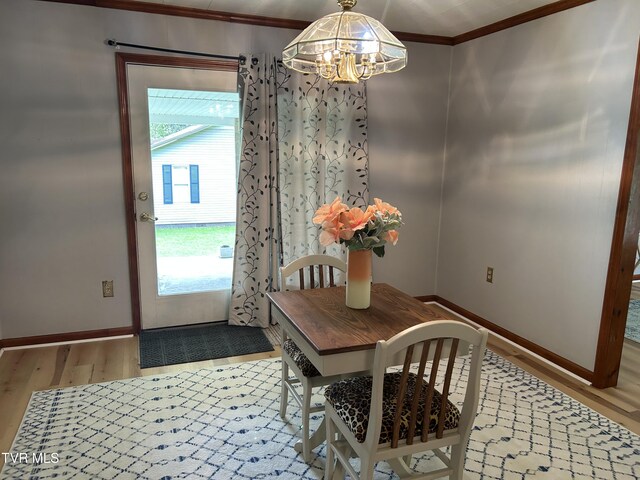 200 Glenbrook Mountain Rd, Keokee, VA 24265 - dining room featuring a chandelier, light wood-style flooring, ornamental molding, and baseboards