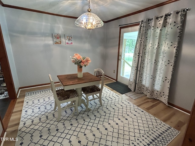 200 Glenbrook Mountain Rd, Keokee, VA 24265 - dining area with crown molding, wood finished floors, a chandelier, and baseboards