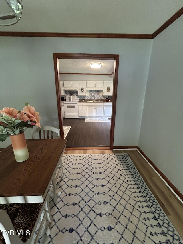 200 Glenbrook Mountain Rd, Keokee, VA 24265 - hall featuring ornamental molding, dark wood finished floors, a sink, and baseboards
