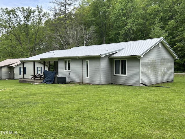 200 Glenbrook Mountain Rd, Keokee, VA 24265 - back of house with central AC, a lawn, metal roof, and a patio area