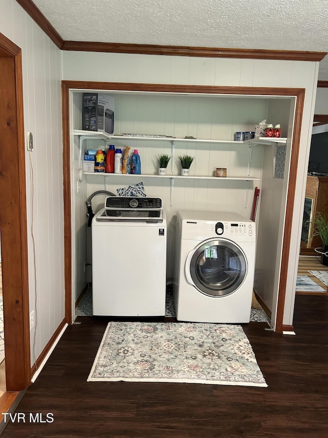 200 Glenbrook Mountain Rd, Keokee, VA 24265 - laundry area with ornamental molding, washer and clothes dryer, dark wood-style flooring, a textured ceiling, and baseboards