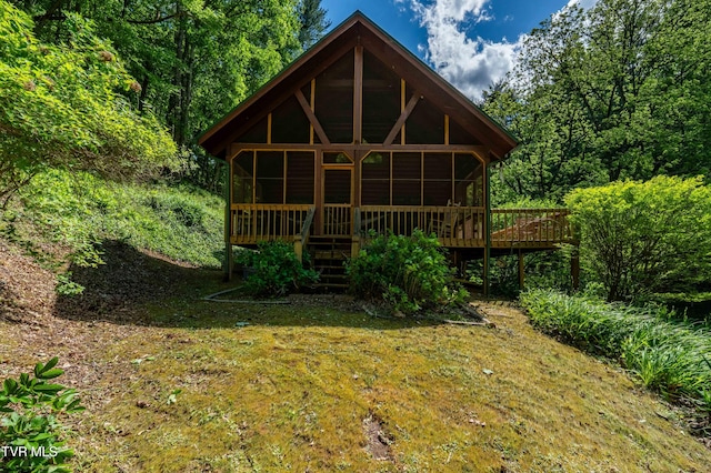 109 Hatley Hollow Rd, Butler, TN 37640 - view of front of house with a sunroom, a wooden deck, and a view of trees