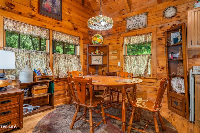 109 Hatley Hollow Rd, Butler, TN 37640 - dining space with wooden walls, light wood-type flooring, high vaulted ceiling, wood ceiling, and a chandelier