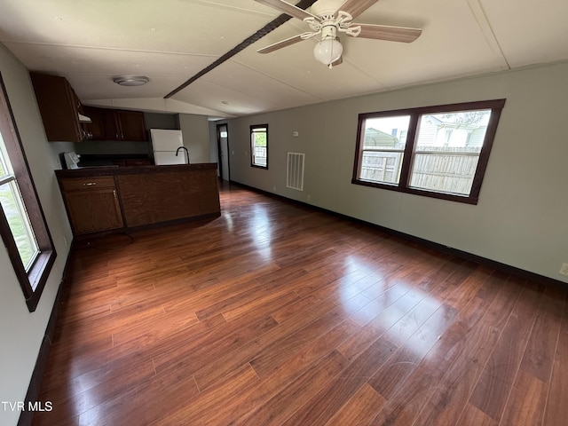 104 Creekbank Rd, Elizabethton, TN 37643 - unfurnished living room with vaulted ceiling, dark wood-style floors, a ceiling fan, a sink, and baseboards