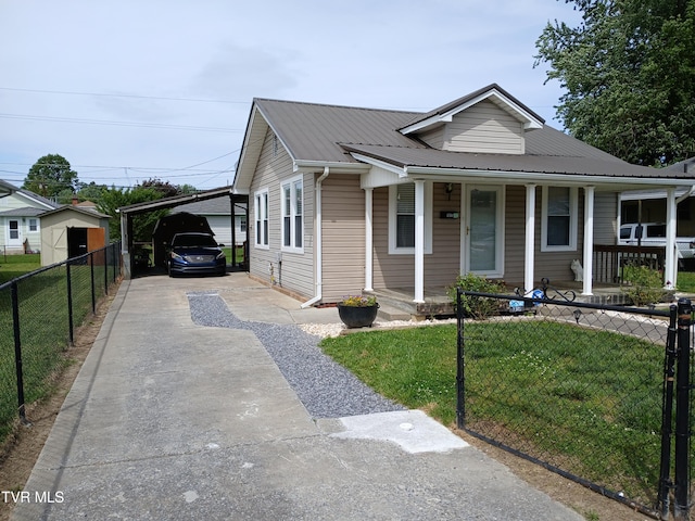 1318 Willow St, Kingsport, TN 37664 - view of front of property featuring concrete driveway, covered porch, metal roof, and a carport