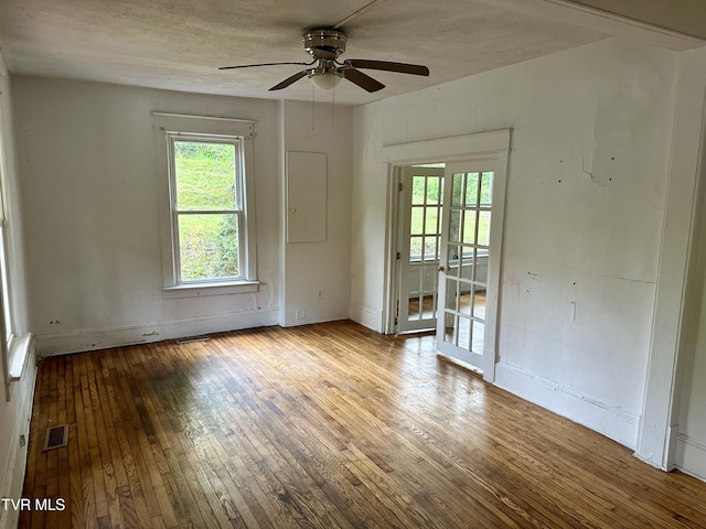 919 Russell St, Bristol, VA 24201 - empty room with hardwood / wood-style flooring, a ceiling fan, and baseboards