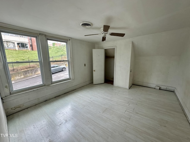 919 Russell St, Bristol, VA 24201 - unfurnished bedroom with light wood-style flooring and a ceiling fan