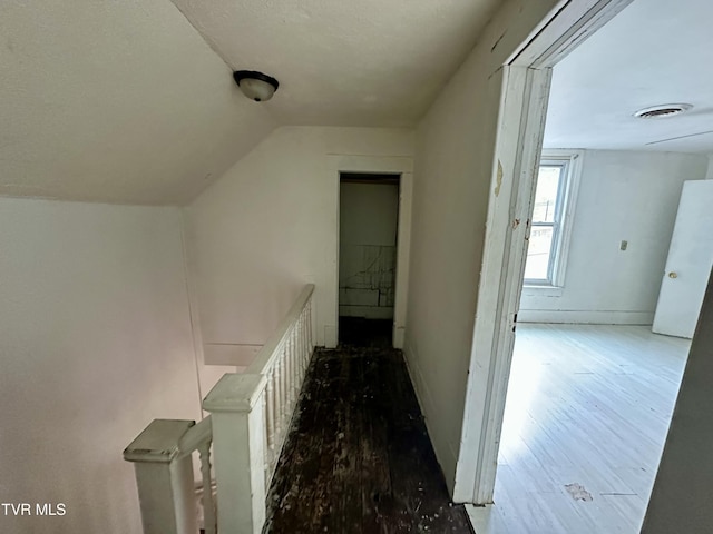 919 Russell St, Bristol, VA 24201 - corridor featuring wood finished floors, lofted ceiling, and an upstairs landing