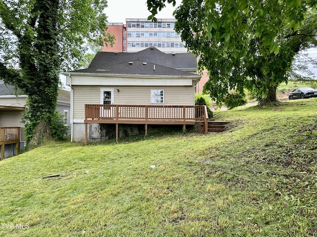 919 Russell St, Bristol, VA 24201 - back of property featuring a wooden deck and a yard