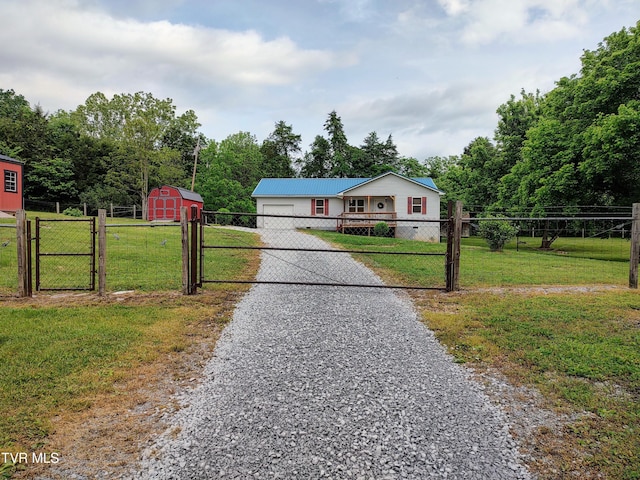 3742 Beech Grove Rd, Jonesville, VA 24263 - single story home featuring a gate, driveway, an attached garage, and an outbuilding