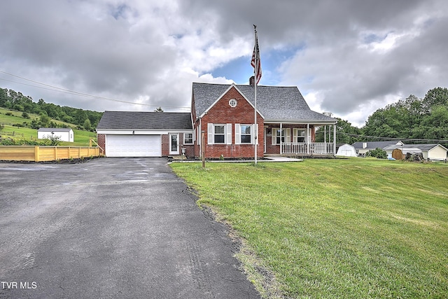 15497 Porterfield Hwy, Abingdon, VA 24210 - view of front of house featuring brick siding, driveway, covered porch, an attached garage, and a shingled roof